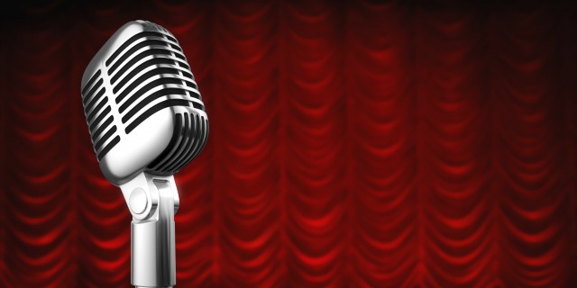 Microphone with Red Background | Assisted Living Suffolk County