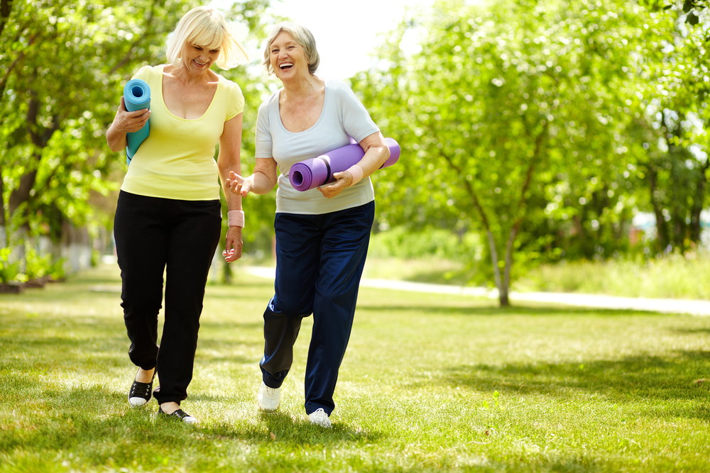 elderly women exercising in park