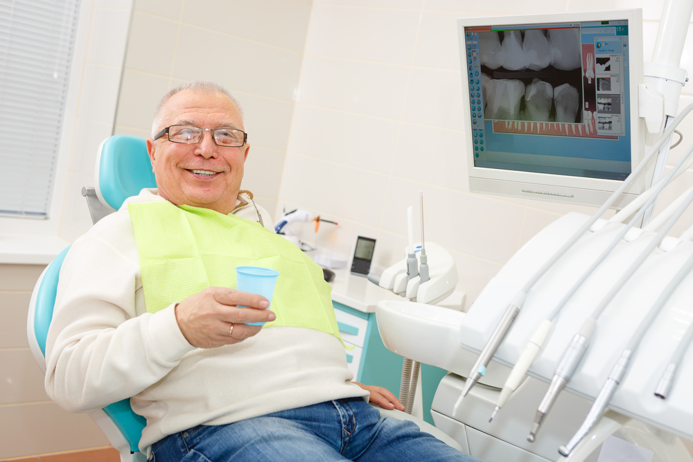 elderly man at the dentist