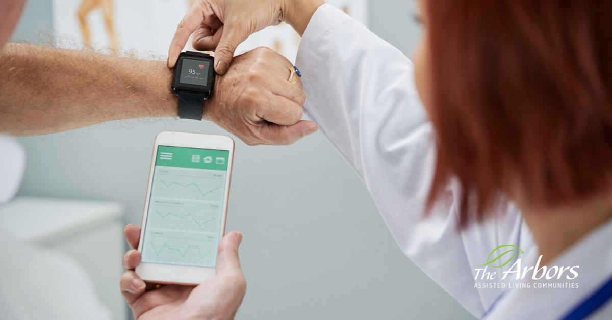 arm of elderly senior and smart watch