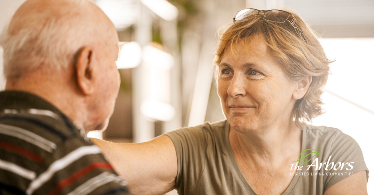 daughter talking with elderly father