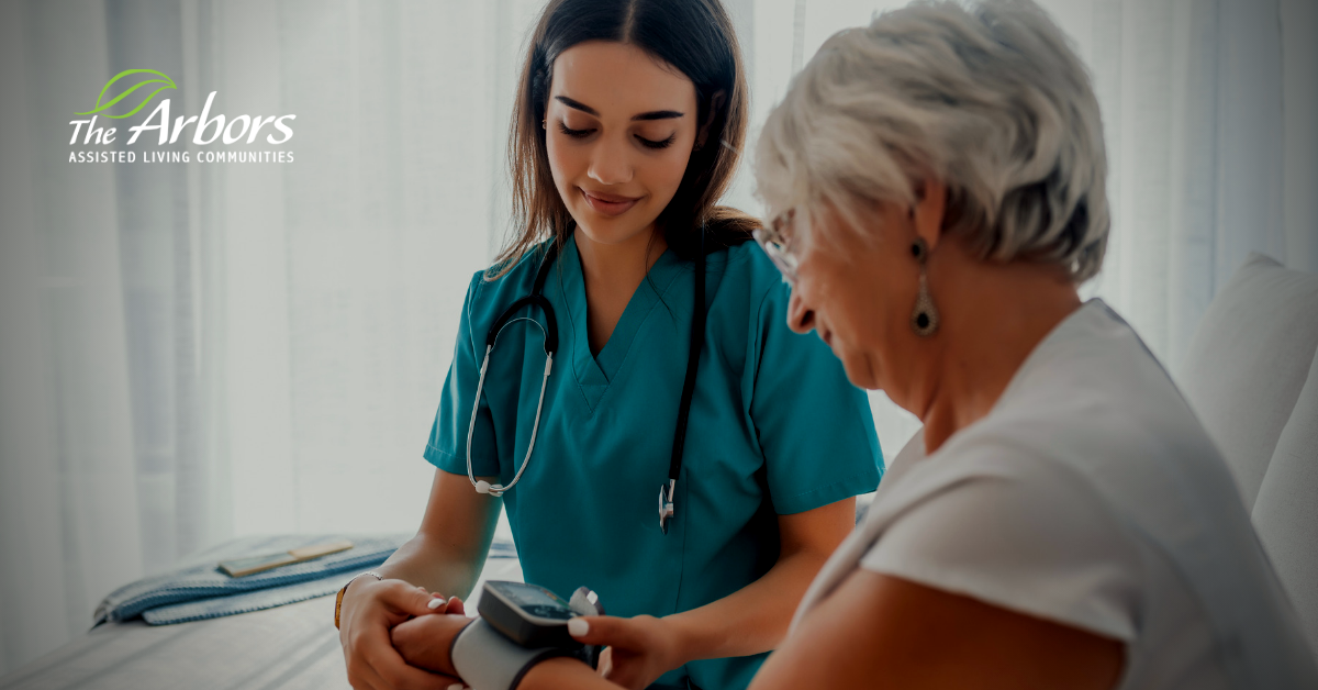 Nurse checking elderly woman's blood pressure.